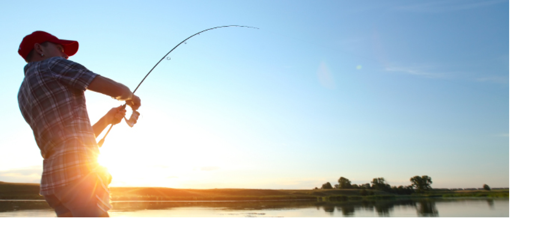 Young man fishing at sunset