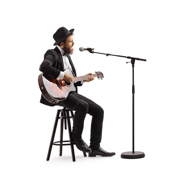 Full length shot of a guy singing on a microphone and playing an acoustic guitar isolated on white background